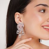 Stunning chandelier-style drop earrings featuring pink quartz stones surrounded by brilliant cubic zirconia in a sophisticated fan pattern