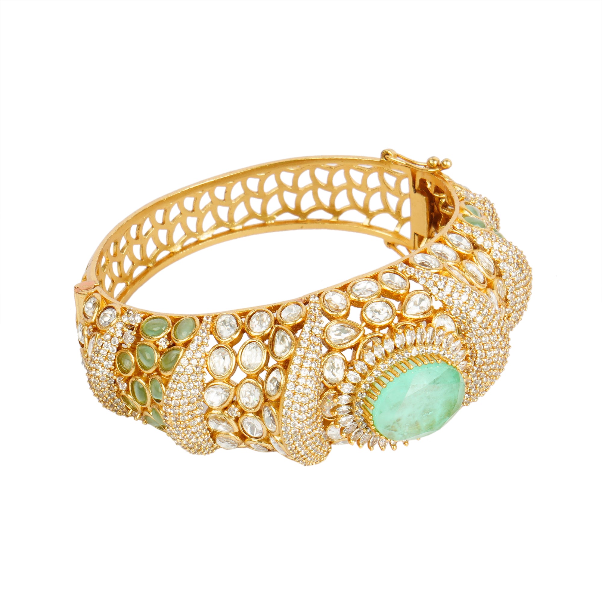 Luxurious gold bracelet with emerald and diamond accents exudes timeless sophistication and regal charm.